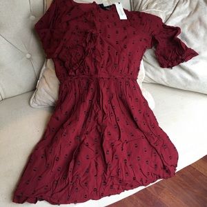 Francesca’s rust red dress black thread details